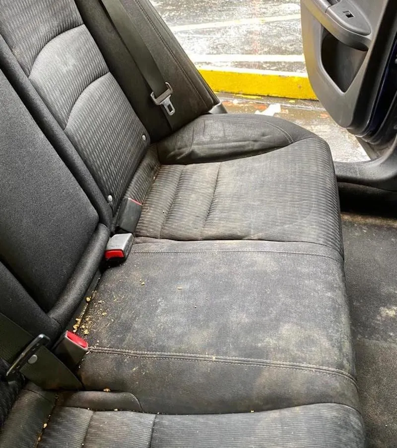 Before: back seat with heavy dirt and debris