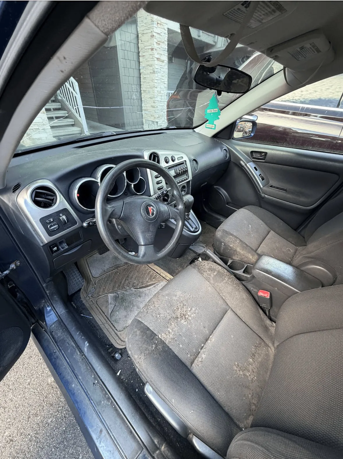 Before: dirty, cluttered interior before detailing