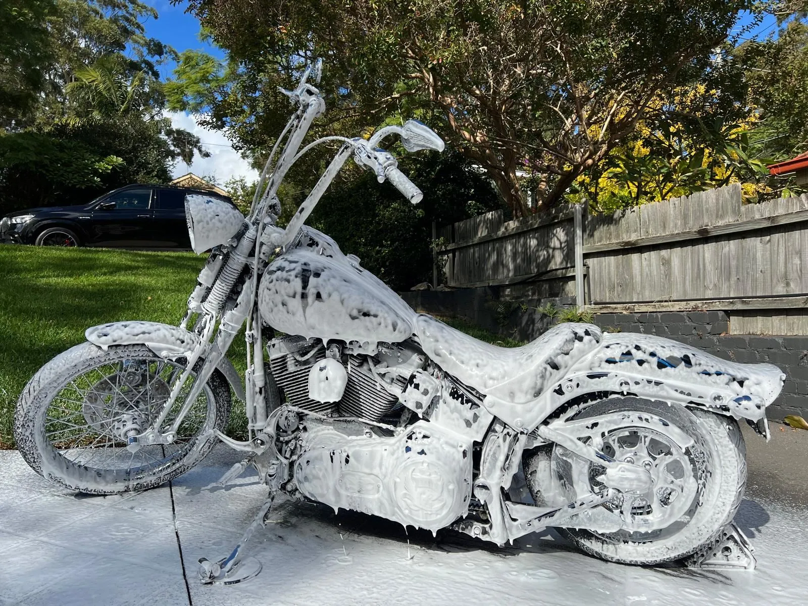 Motorcycle covered in wash foam