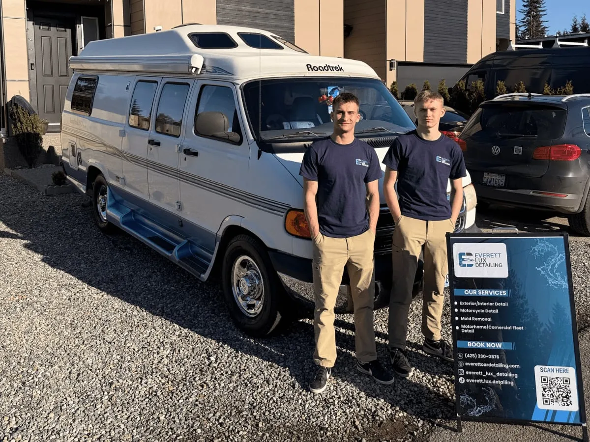 Two Everett Lux Detailing detailers beside a camper van they detailed