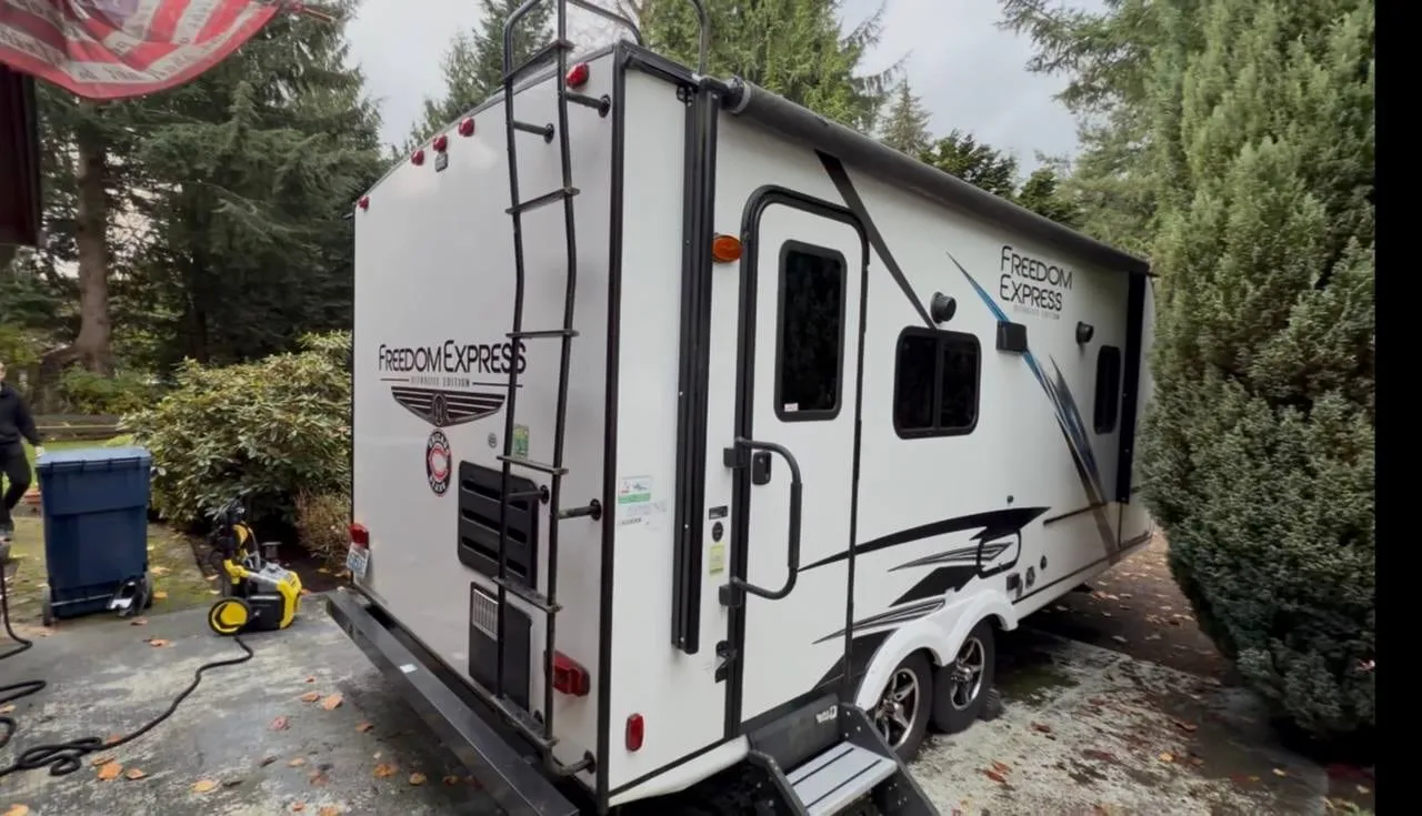 Travel trailer during a mobile wash