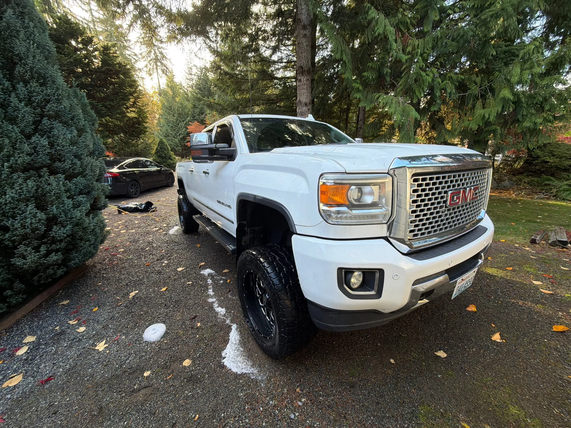 White GMC Sierra Denali pickup after a mobile detail